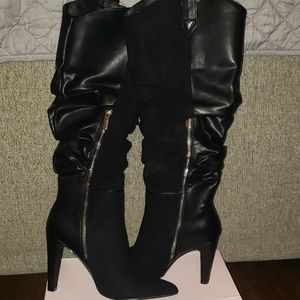 Black western style heeled boots by just fab. Size 7